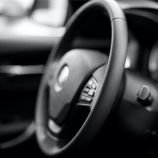 A modern car interior focused on the steering wheel